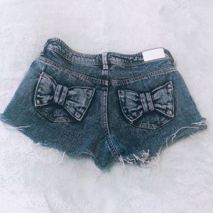 Navy blue bow butt jean shorts.